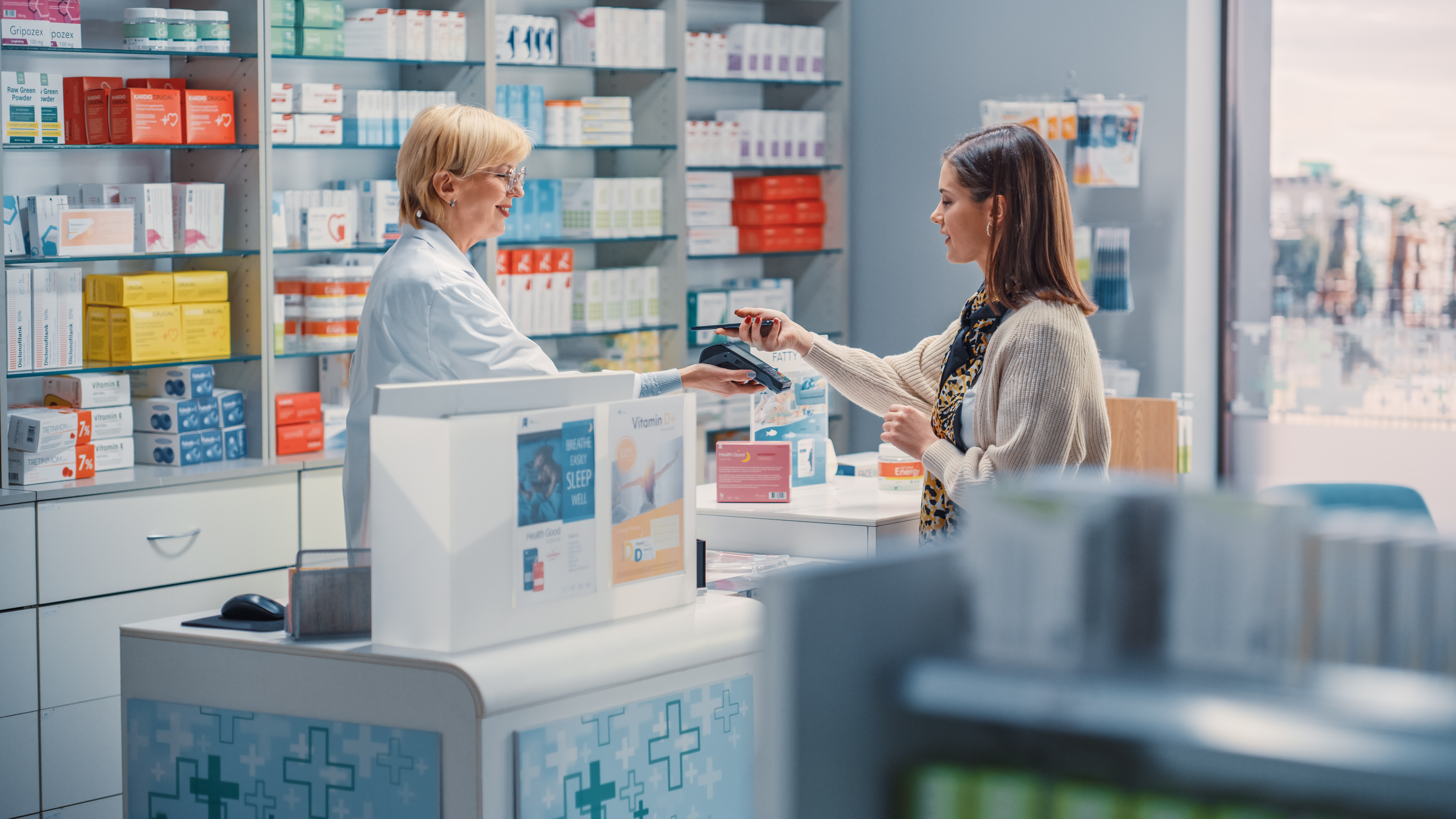 woman in pharmacy getting a prescription