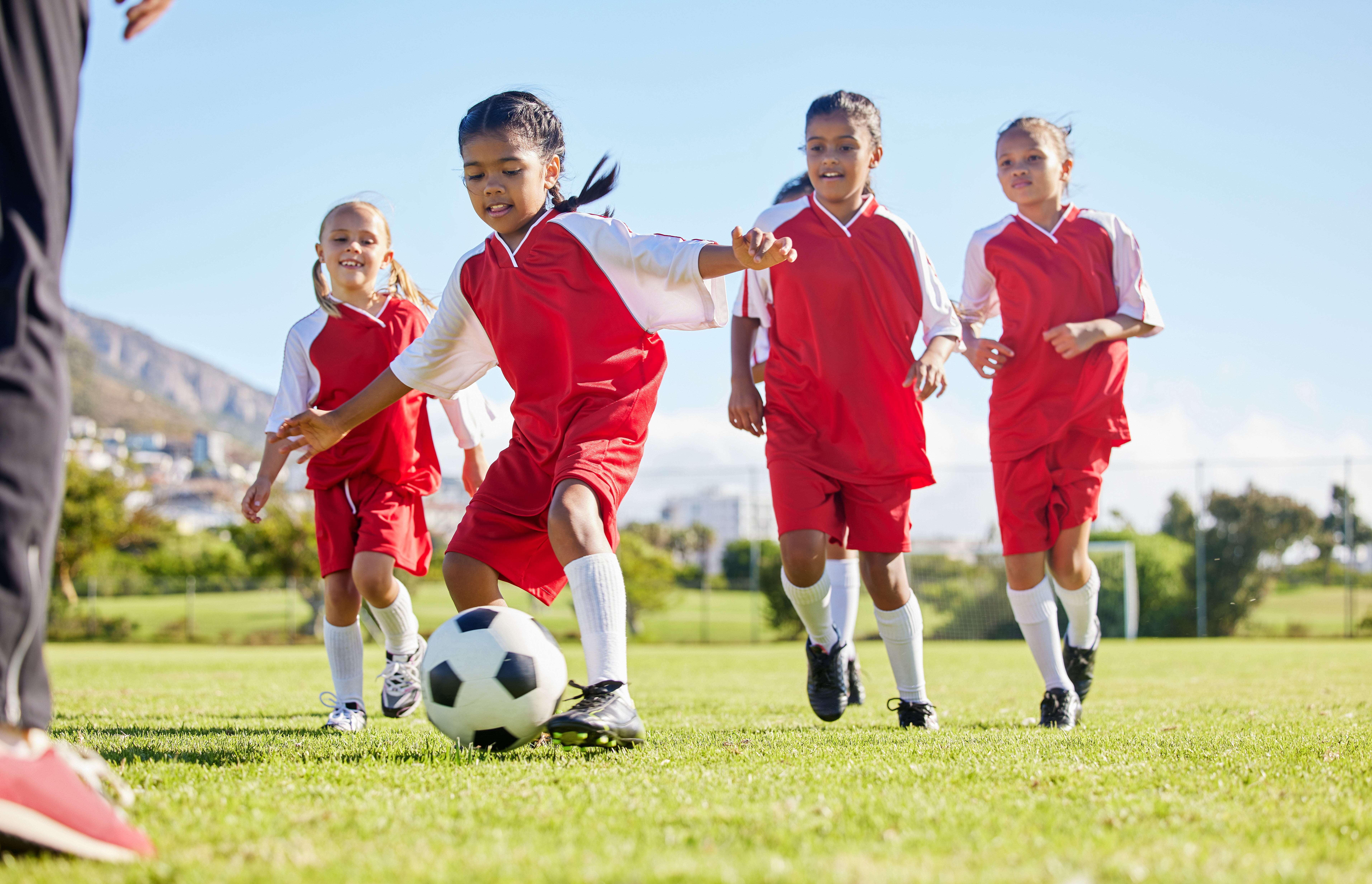 girls playing soccer 