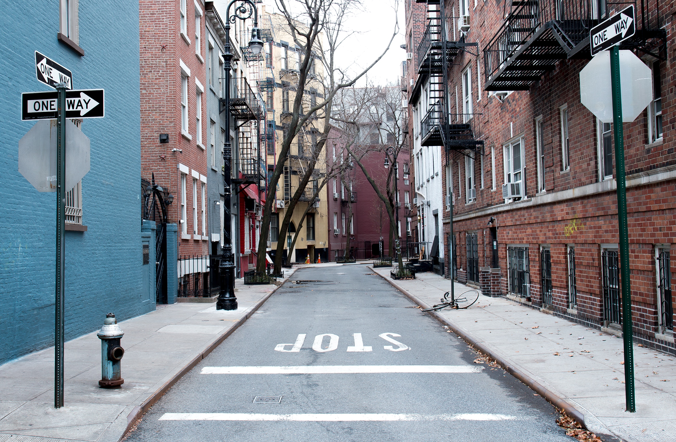 Street between two blocks of houses 