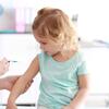 Young girl receiving a vaccination in a medical office.