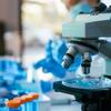 Laboratory setting with test tubes and microscope