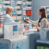 woman in pharmacy getting a prescription
