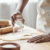 Baker cutting out dough
