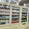Display case with assorted cigarette packs and Marlboro advertisements