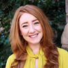 Redheaded woman in a yellow shirt